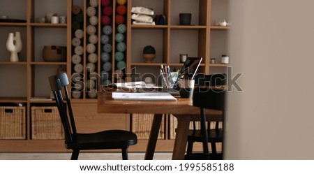 Modern creative workplace with laptop notebook mock up white empty screen on desk at work space office room interior