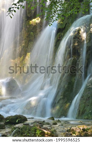 Mountain waterfall close-up in summer