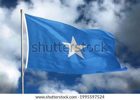 Somalia flag on sky and cloud background. National symbols of Somalia. Flag of Somalia.