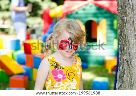 blond girl with face painting
