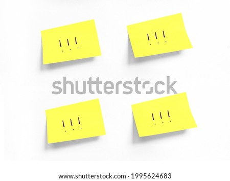Four Yellow stickers with Exclamation points on white Whatman paper. Isolated without any labels. Concept learn, starting education. Handwriting text, copy space Royalty-Free Stock Photo #1995624683