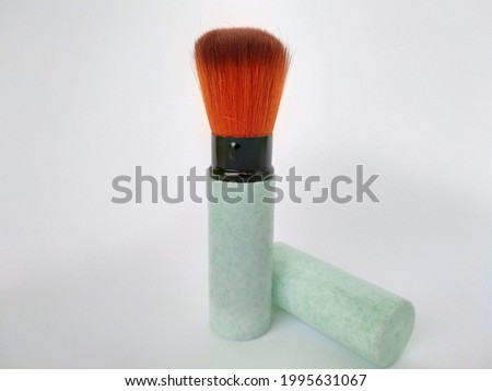 A beautiful cute brush for blush on or powder application with white background editable for product selling
