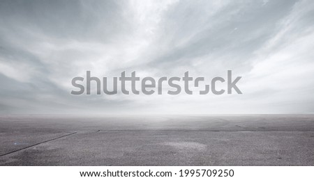Floor Background with Storm Clouds Dramatic Sky Horizon Panorama Royalty-Free Stock Photo #1995709250