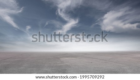 Blue Sky Landscape Background with Nice Clouds and Empty Concrete Floor Royalty-Free Stock Photo #1995709292