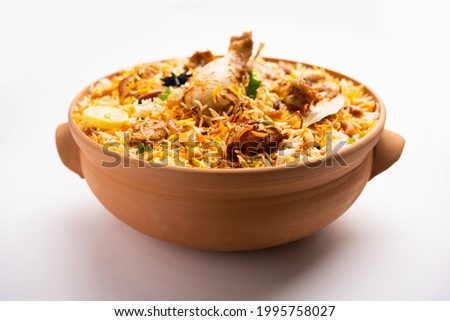 Dum Handi chicken Biryani is prepared in an earthen or clay pot called Haandi. Popular Indian non vegetarian food Royalty-Free Stock Photo #1995758027