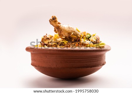 Dum Handi chicken Biryani is prepared in an earthen or clay pot called Haandi. Popular Indian non vegetarian food Royalty-Free Stock Photo #1995758030