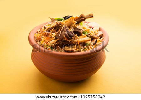 Dum Handi Mutton Biryani or gosht pilaf is prepared in an earthen or clay pot called Haandi or 1 kilo size. Popular Indian non vegetarian food Royalty-Free Stock Photo #1995758042