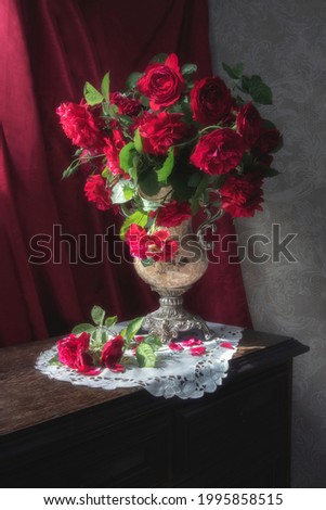 Still life with bouquet of magenta roses