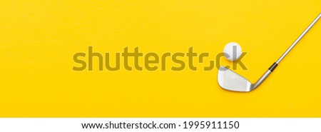 White golf ball and stick on yellow background. Horizontal sport poster, greeting cards, headers, website