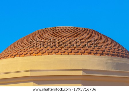 Mascagni Terrace. The roof of the music Gazebo and the blue sky.