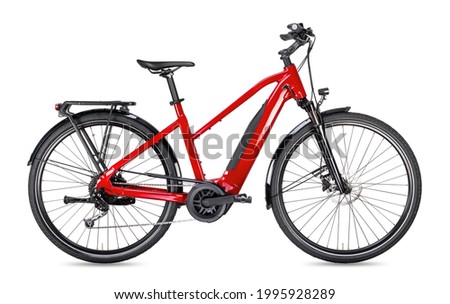 red modern mid drive motor city touring or trekking e bike pedelec with electric engine middle mount. battery powered ebike isolated on white background. Innovation transportation concept.
