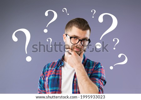 Question sign with a beautiful alarmed man on pastel background