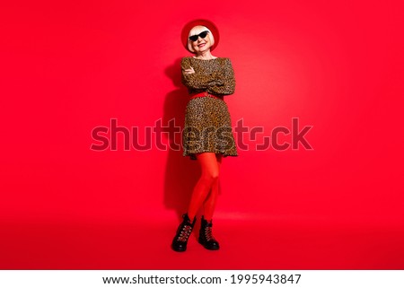 Photo of charming happy nice confident old lady hold hands crossed good mood isolated on red color background