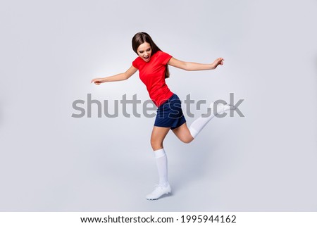 Full body profile photo of cool lady player soccer team showing freestyle tricks kick ball exercise wear football uniform t-shirt shorts cleats socks isolated white color background
