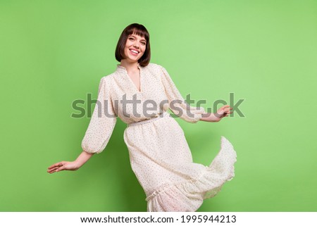 Photo of young attractive girl happy positive smile wear glamour dress isolated over green color background