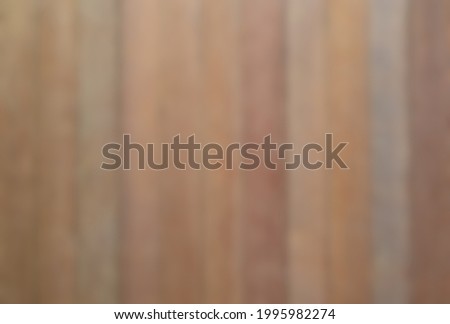 blurred vertically arranged brown old plank background empty use as backdrop