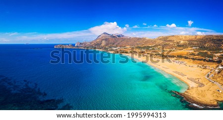 Aerial shot of beautiful turquoise beach Falasarna (Falassarna) in Crete, Greece. View of famous paradise sandy deep turquoise beach of Falasarna (Falassarna) in North West, Crete island, Greece. Royalty-Free Stock Photo #1995994313