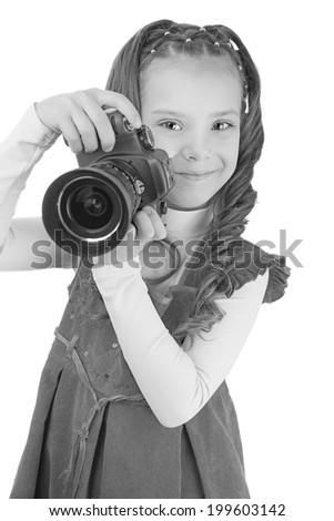 Portrait of beautiful smiling little girl in red dress with camera, isolated on white background.