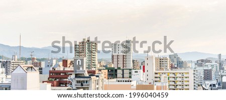 Asia Business concept for real estate and corporate construction - panoramic urban city aerial view under bright blue sky and sun in Tenjin, Fukuoka Japan