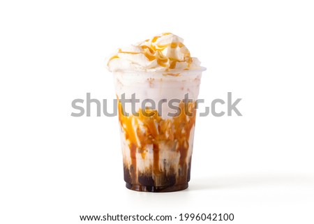 caramel macchiato coffee with caramel and whipping cream in glass Isolate on white background. cafe menu concept. Royalty-Free Stock Photo #1996042100