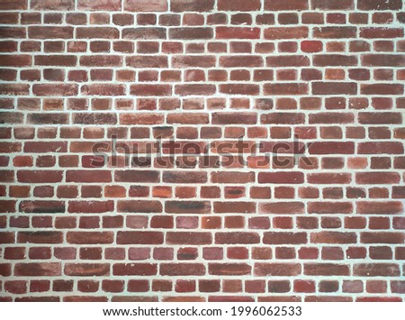 Red brick wall texture grunge background with vignetted corners to interior design
