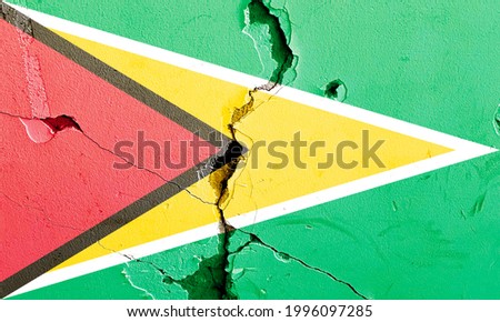 Guyana national flag icon grunge pattern painted on old weathered broken wall background, abstract Guyana politics economy society issues concept texture wallpaper