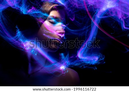 Portrait in the style of light painting. Long exposure photo, abstract portrait , psychedelic poster