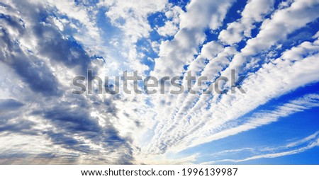 White cirrocumulus clouds blue sky background panorama, altocumulus cloudy skies panoramic view, stratocumulus cloud texture, cirrus cumulus cloudscape, sunny heaven landscape, cloudiness backdrop Royalty-Free Stock Photo #1996139987