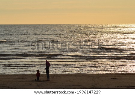 Father and child at beach