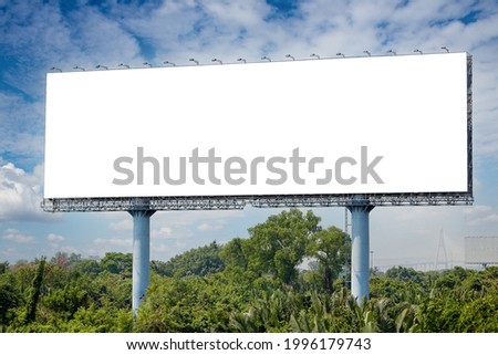 blank billboard on the sideway in the park. image for copy space, advertisement, text and object. white billboard in natural green. Royalty-Free Stock Photo #1996179743