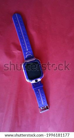 a watch that can be used to make calls.  isolated on red