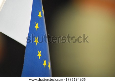 European Union flag with colorful blurred background