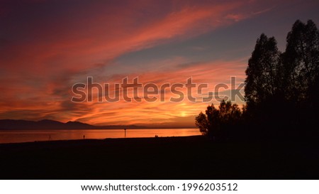 The nightfall sunset at Lochau beach on Lake Constance in Austria  Royalty-Free Stock Photo #1996203512