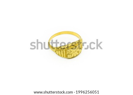 Real gold processed into gold ring ornaments on a white background