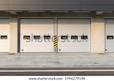 Garages door detail in race circuit. Royalty-Free Stock Photo #1996279148