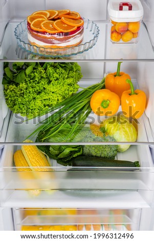 Open fridge full of fresh fruits and vegetables, healthy food background, organic nutrition, health care, dieting concept