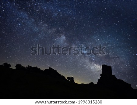 a sky with stars and a castle