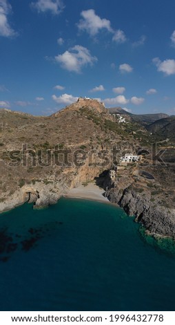 Aerial drone photo of small secluded cove and beach of Sparagario below iconic castle of Kythira island main village, Ionian, Greece