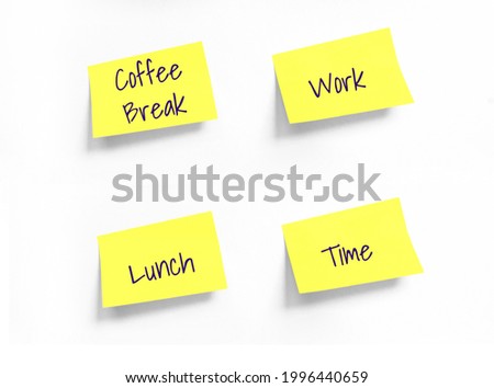 Four Yellow stickers with Coffee Break, Work, Lunch, Time Handwriting text on white Whatman paper. Concept of work, programming, testing, business. Handwriting text, copy space Royalty-Free Stock Photo #1996440659