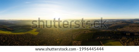 the siegerland forest and city from above in germany in autumn as a high definition panorama Royalty-Free Stock Photo #1996445444