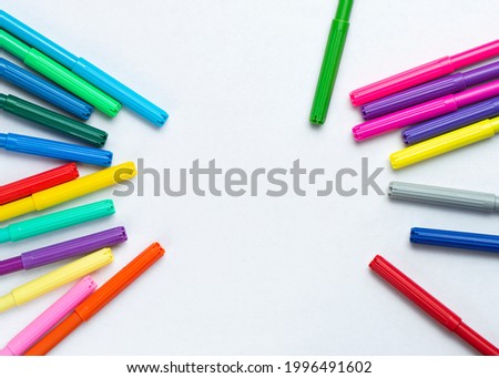 felt-tip pens and white paper Royalty-Free Stock Photo #1996491602