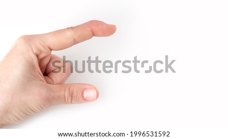 part of left hand showing size, how big, long with index finger and thumb, index finger with a extensor tendon injury, mallet finger, tip bending downwards, deformity in the last phalangeal bone Royalty-Free Stock Photo #1996531592