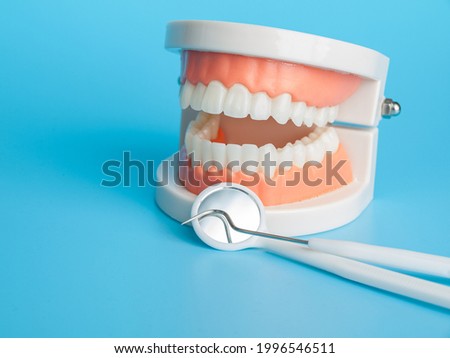 Dental instruments for oral examination, probe and dental mirror, primary medical examination at the dentist, oral health and care Royalty-Free Stock Photo #1996546511