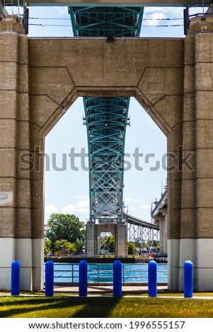 underneath symmetrical picture of the Blue Water Bridge to Canada from the United States. 