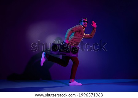 Full length body size side profile photo guy cheerful got tape recorder dancing isolated purple color background