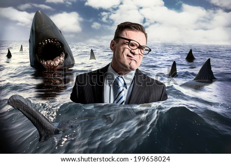 Businessman and sharks Royalty-Free Stock Photo #199658024