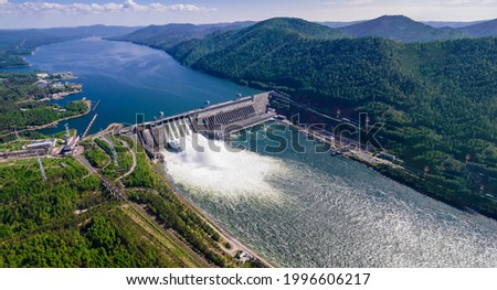 View of the hydroelectric dam on the river, water discharge from the locks, aerial photo Royalty-Free Stock Photo #1996606217