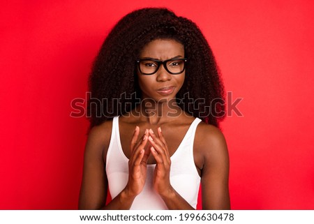 Photo of young unhappy moody african girl think hesitate minded brainstorming plan isolated over red color background