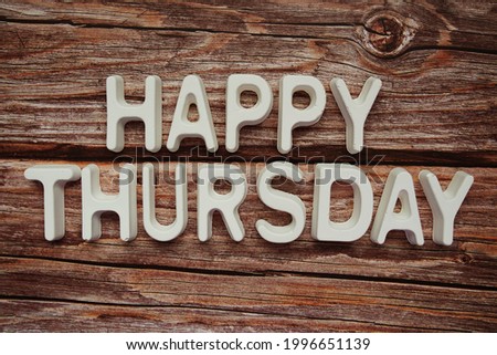 Happy Thursday text message on wooden background Royalty-Free Stock Photo #1996651139