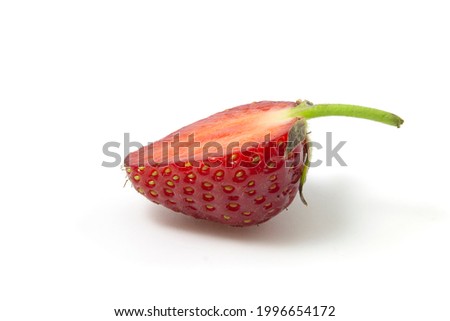 Strawberries in section lies sideways isolated on a white background. Full focus